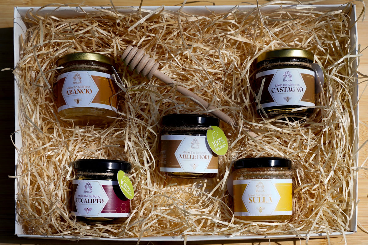 Box degustazione vista dall'alto: miele di Arancio, Castagno, Eucalipto, Millefiori e Sulla nella paglia