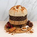 Panettone Lotus e cioccolato bianco su alzata in legno
