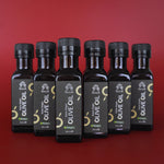 Coffret de 6 bouteilles d'huile d'olive vierge extra bio Racilia 100 ml sur fond rouge
